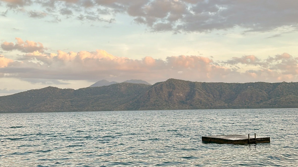 Volcanic crater lake, Laguna de Apoyo, in Nicaragua during sunset.