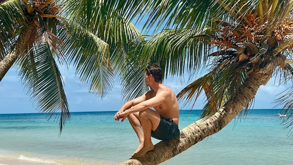 Relaxing on a palm tree at Otto Beach on Little Corn Island on the Caribbean side of Nicaragua.